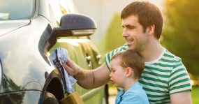 Dad & kid washing car